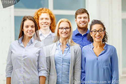 Image of happy creative team in office