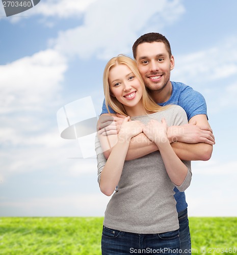 Image of smiling couple hugging