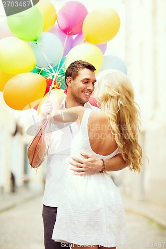 Image of couple with colorful balloons