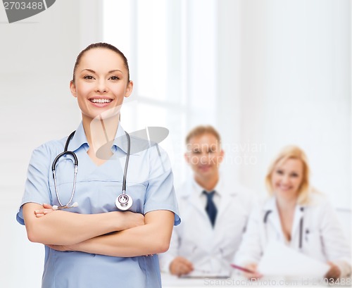 Image of smiling female doctor or nurse with stethoscope