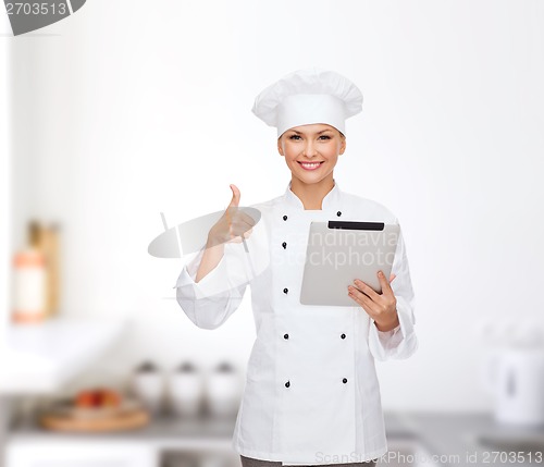 Image of smiling female chef with tablet pc computer