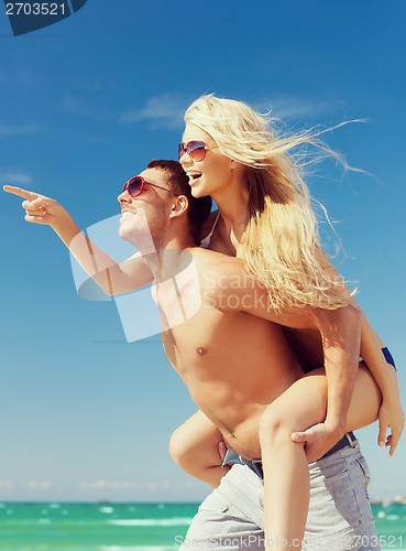 Image of couple having fun on the beach