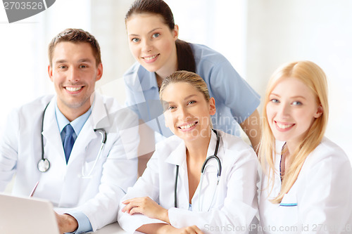 Image of group of doctors with laptop computer
