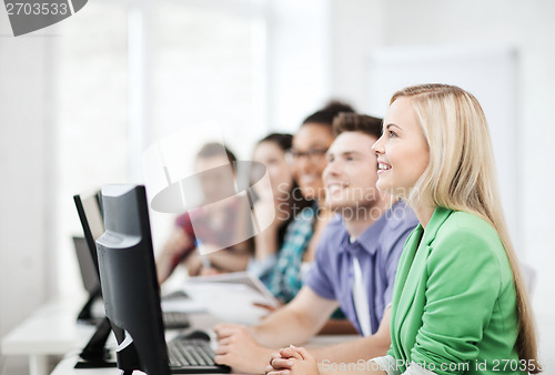 Image of students with computers studying at school