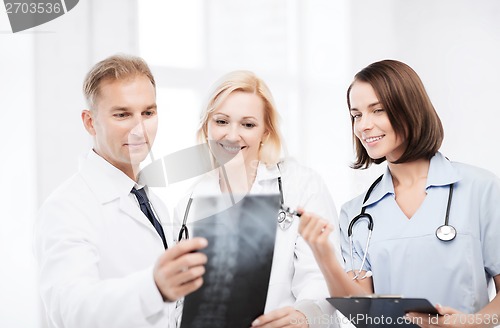 Image of doctors looking at x-ray