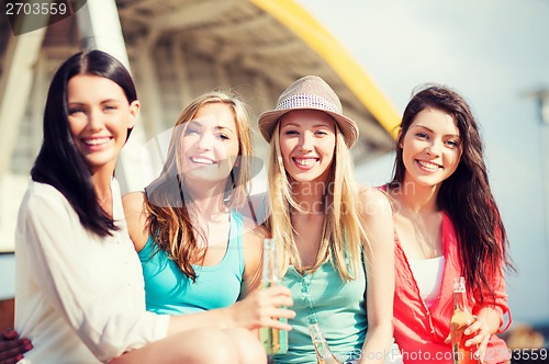 Image of girls with drinks on the beach