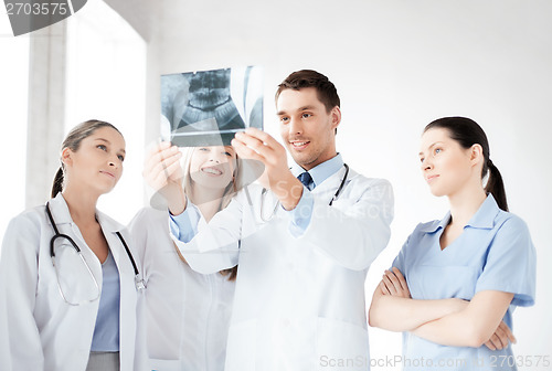 Image of young group of doctors looking at x-ray