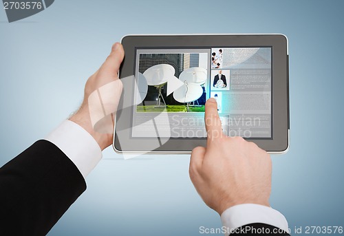 Image of close up of man hands touching tablet pc