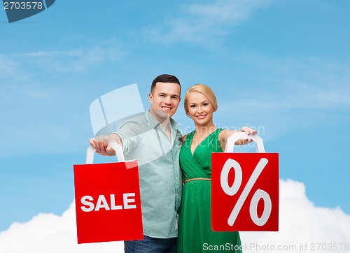 Image of smiling couple with shopping bags