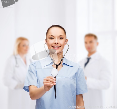 Image of smiling female doctor or nurse with stethoscope