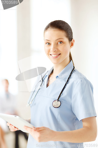 Image of smiling female doctor or nurse with tablet pc