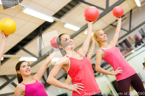 Image of group of people working out with stability balls