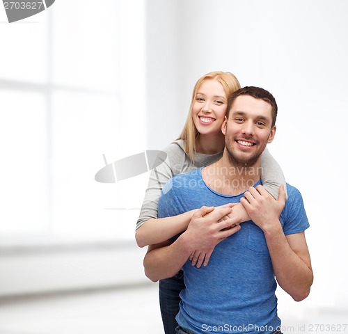 Image of smiling couple hugging