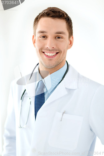 Image of young male doctor with stethoscope in hospital