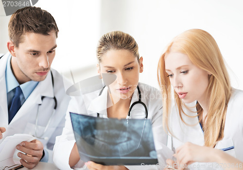 Image of young group of doctors looking at x-ray