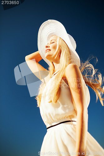 Image of beautiful woman enjoying summer outdoors