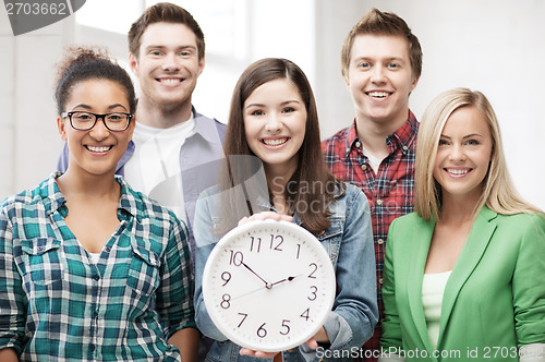 Image of group of students at school with clock