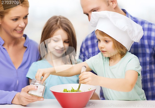 Image of happy family with two kids eating at home