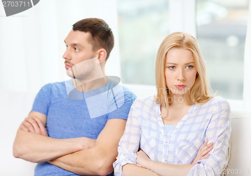 Image of unhappy couple having argument at home