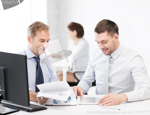 Image of businessmen with notebook and tablet pc