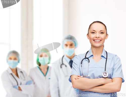 Image of smiling female doctor or nurse with stethoscope