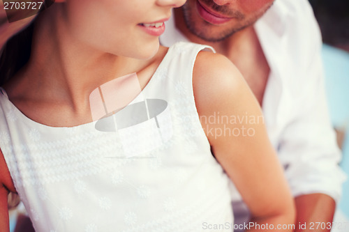 Image of couple in shades at sea side