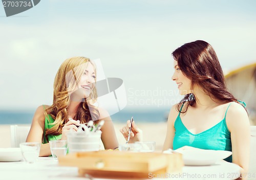 Image of girls in cafe on the beach