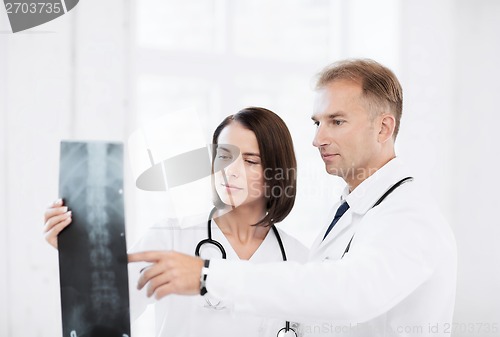 Image of two doctors looking at x-ray