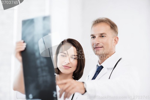 Image of two doctors looking at x-ray