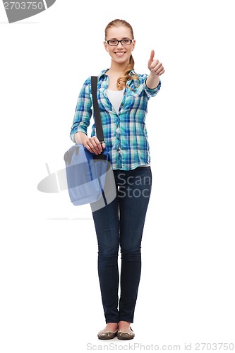 Image of student with laptop bag showing thumbs up