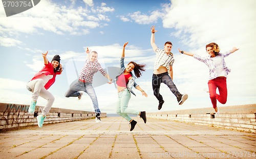 Image of group of teenagers jumping