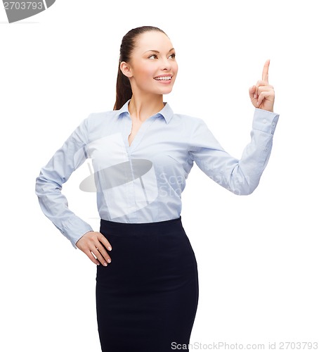 Image of attractive young businesswoman with her finger up