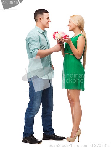 Image of smiling couple with flower bouquet