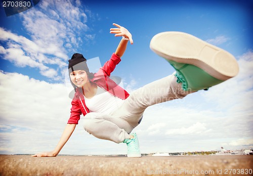 Image of beautiful dancing girl in movement