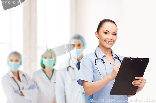 Image of smiling female doctor or nurse with stethoscope