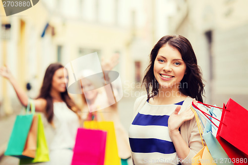 Image of girls with shopping bags in city