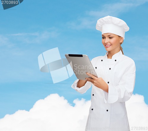 Image of smiling female chef with tablet pc computer