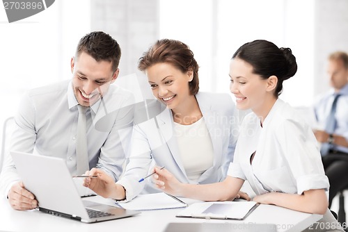 Image of business team having discussion in office