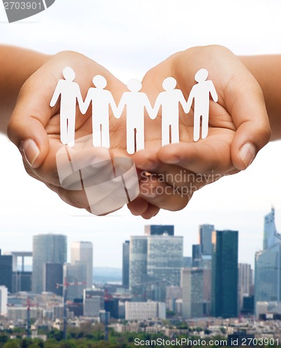 Image of womans hands with paper team