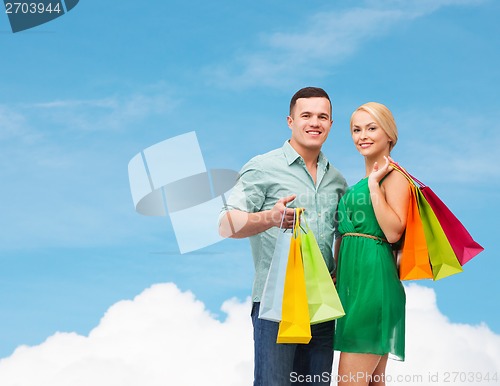 Image of smiling couple with shopping bags