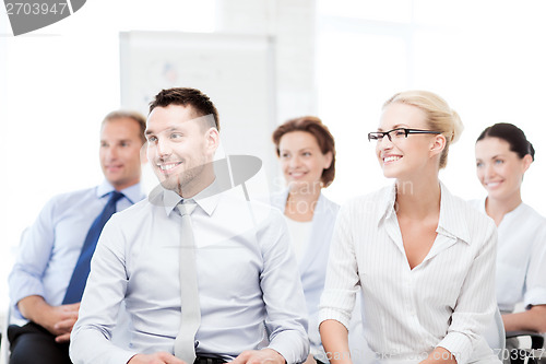 Image of businessmen and businesswomen on conference