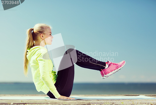 Image of woman doing sports outdoors