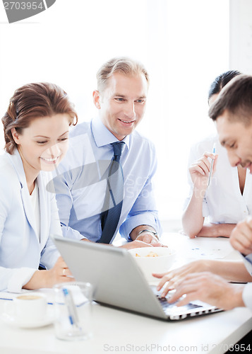 Image of businessman with team on meeting in office