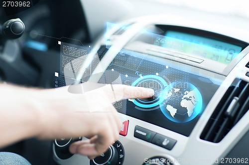 Image of man using car control panel