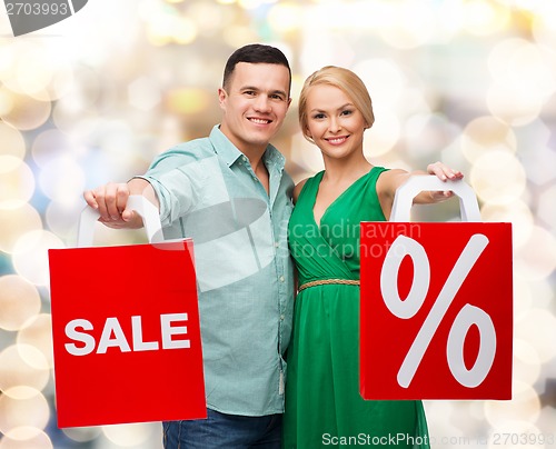 Image of smiling couple with shopping bags