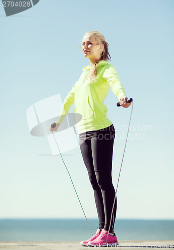 Image of woman doing sports outdoors