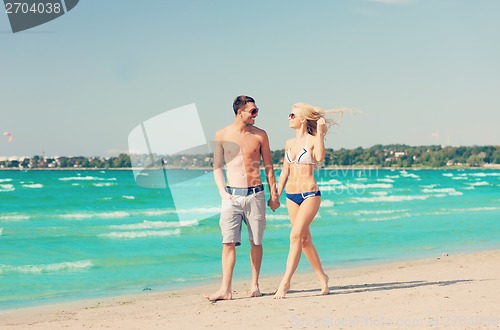 Image of couple walking on the beach