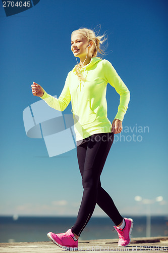 Image of woman doing sports outdoors