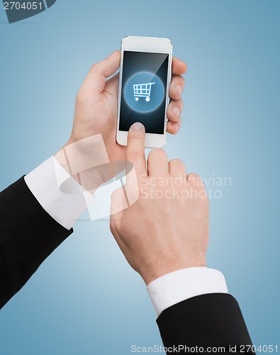 Image of businessman touching screen of smartphone