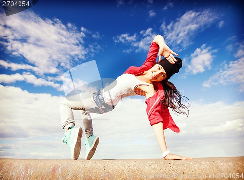 Image of beautiful dancing girl in movement